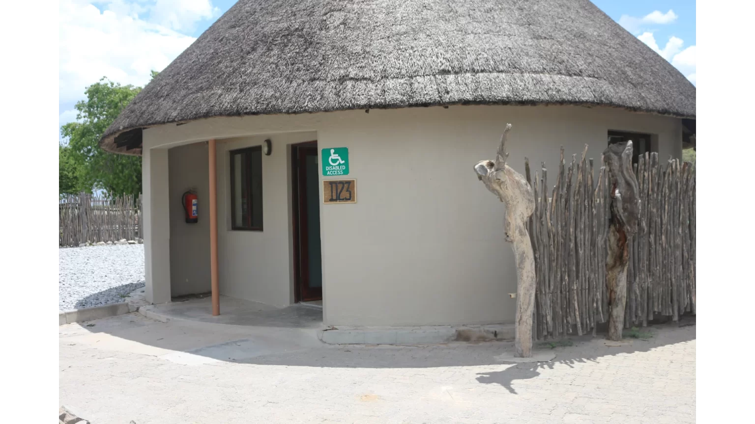 Thatched rondavel exterior at Okaukuejo Camp