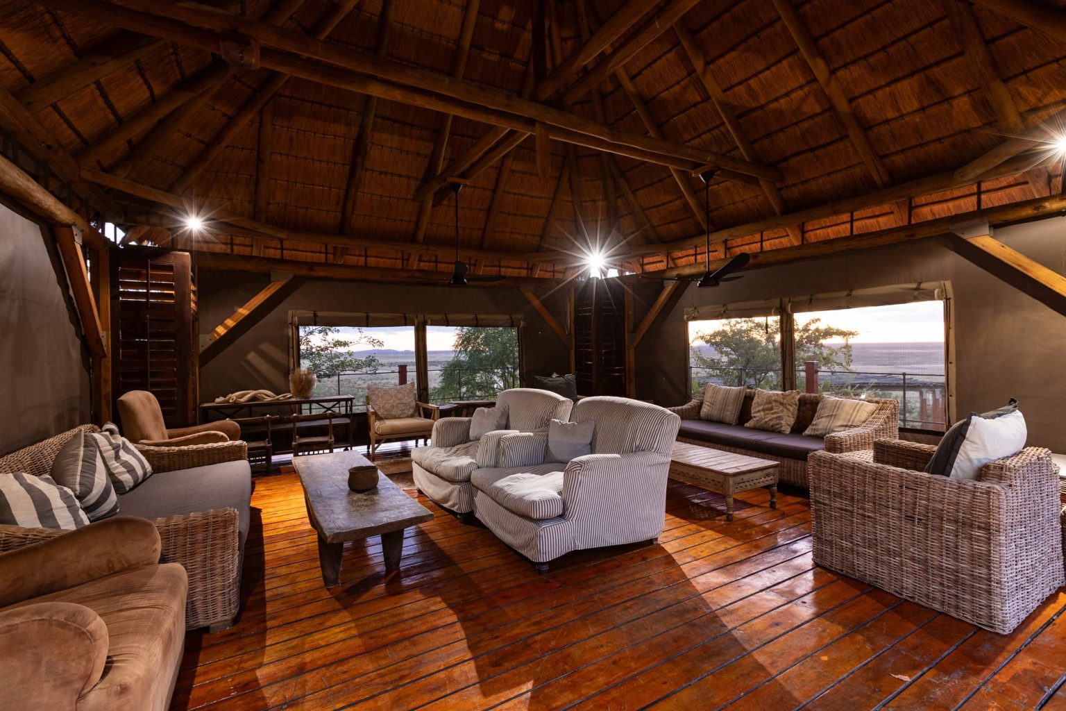 Thatched open-sided main lounge at Dolomite Camp, Etosha