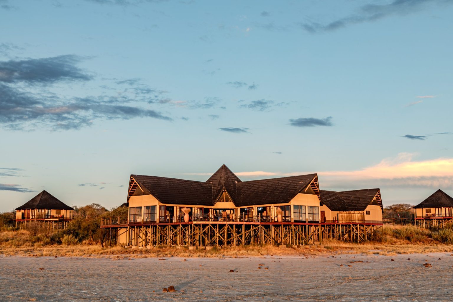 Onkoshi Camp chalets raised on stilts above the pan edge